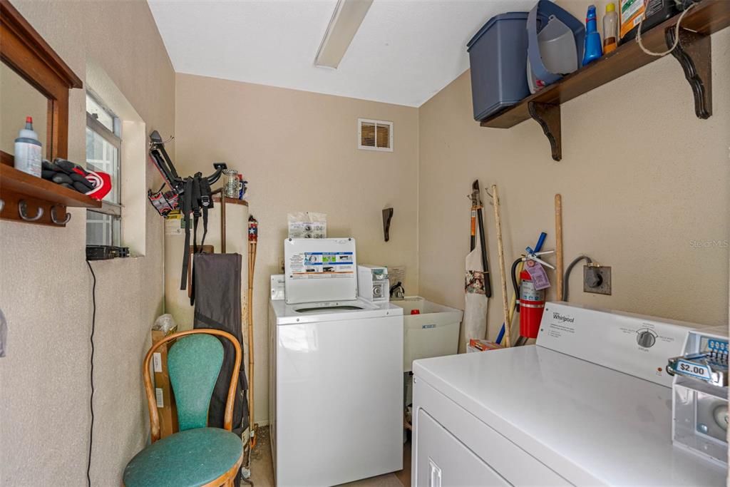 LAUNDRY ROOM before hurricane - NO Washer dryer or hot water heater now- but shows it all fits