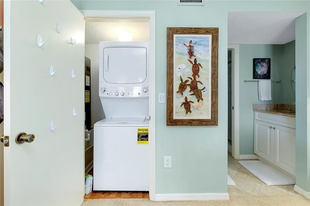 The washer and dryer area are conveniently located in a closet within the primary bedroom.