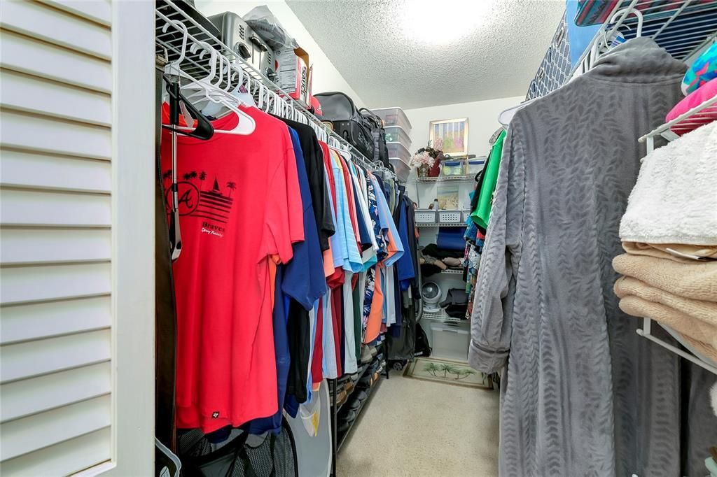 Primary bedroom walk-in closet.