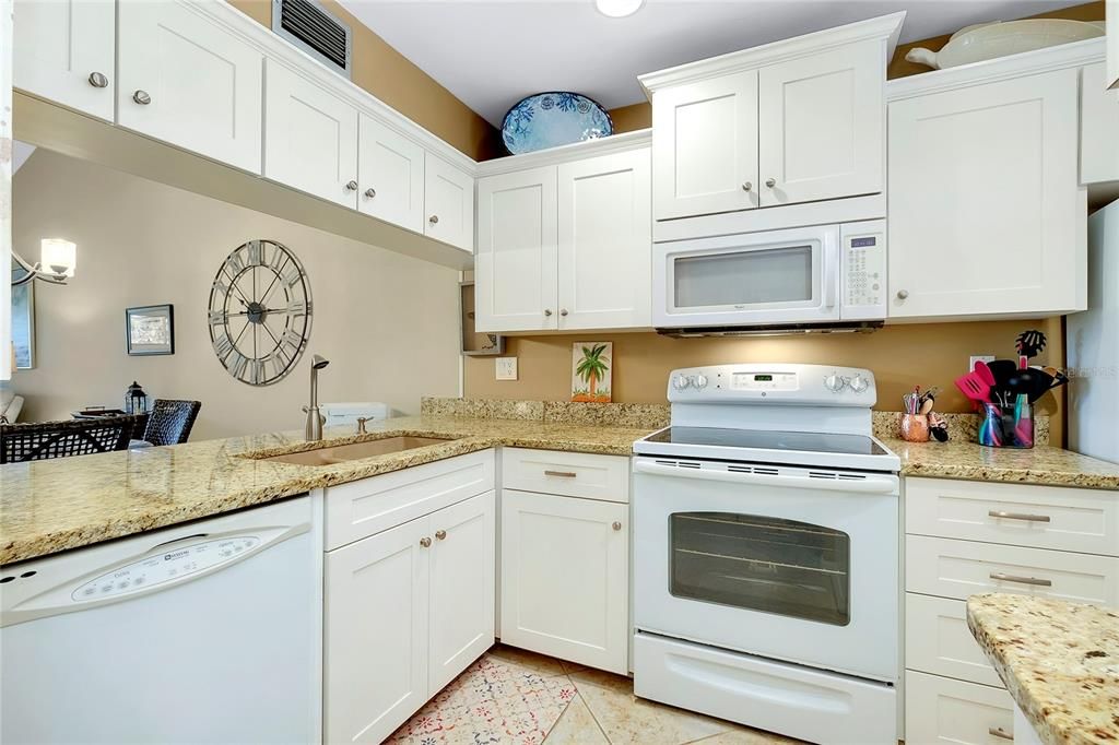 Kitchen cabinetry has easy-close doors and drawers.