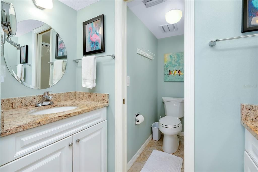 Primary bedroom bath has separate dual vanities.