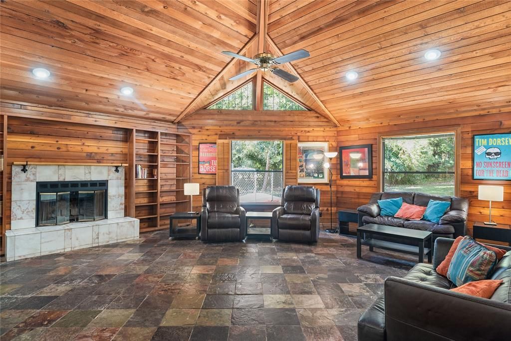 Family room is complete with a fireplace and built-in bookcases, is perfect for relaxing evenings.