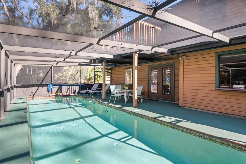 This screened-in pool provides a refreshing escape from the heat and a perfect spot for entertaining.