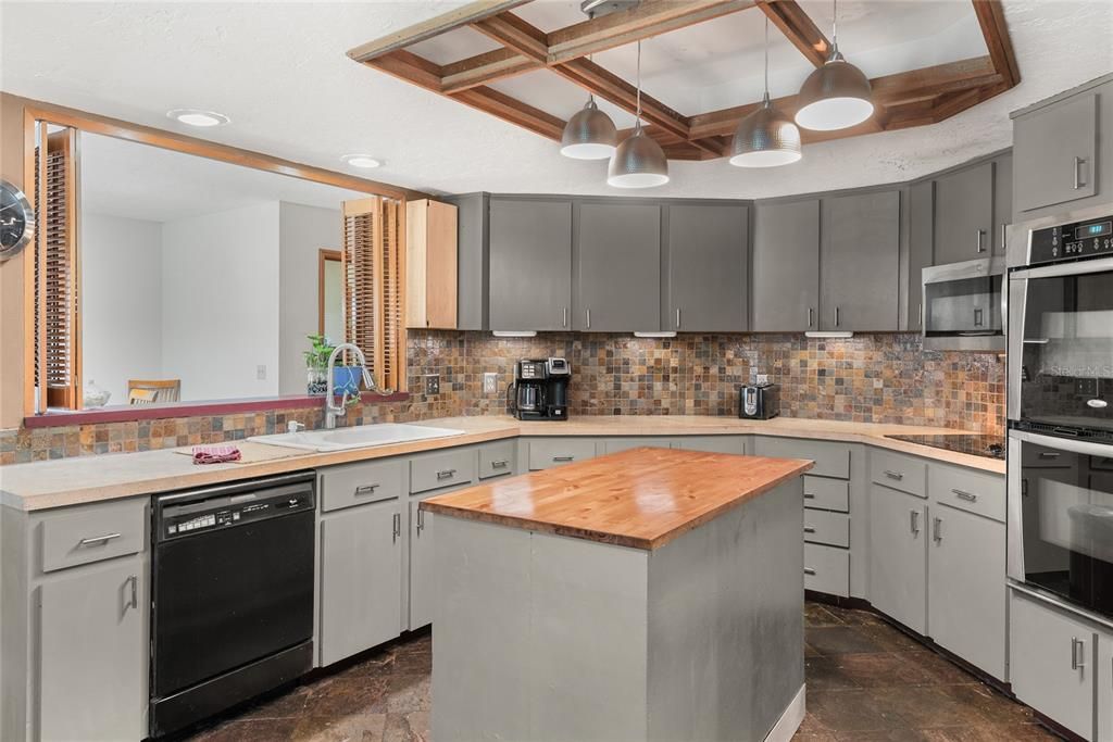 The spacious kitchen features ample counter space, a large island, and plenty of storage for all your culinary needs.