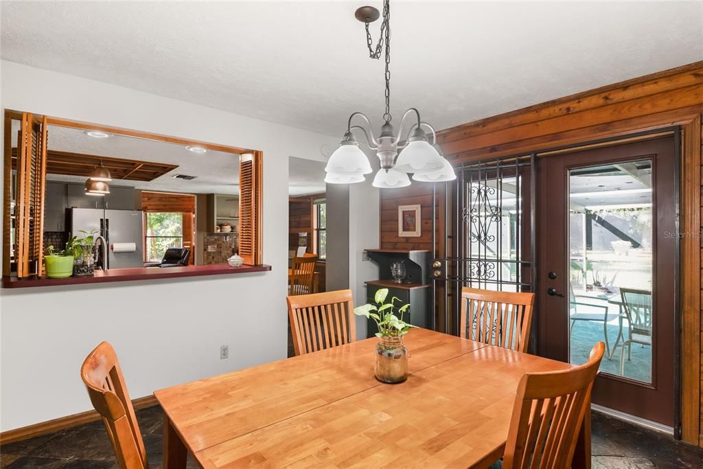 Another view of the dining room showcasing the charming details and connection to the kitchen.