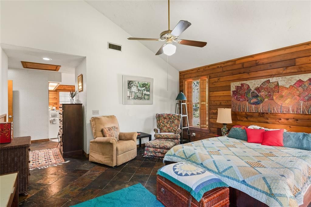 Another view of the primary bedroom highlights the spacious layout.