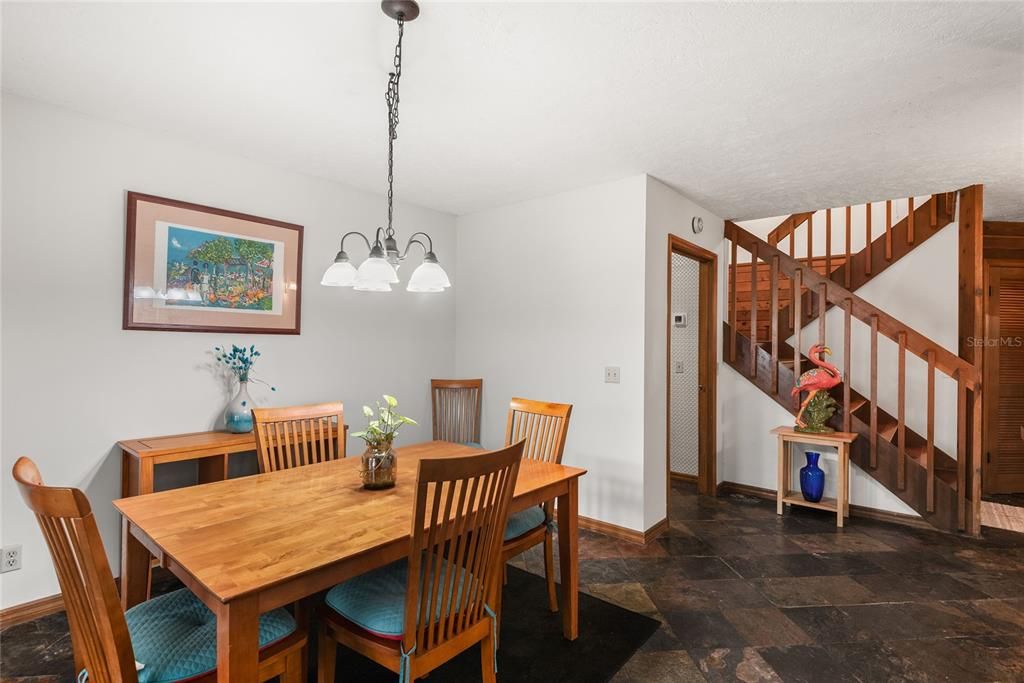 The dining room offers plenty of space for family meals and entertaining, with easy access to both the kitchen and living areas.