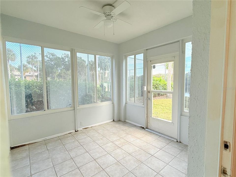 FLORIDA ROOM WITH DIRECT LAKE FRONT VIEWS!! LOOKING FROM THE MASTER BEDROOM