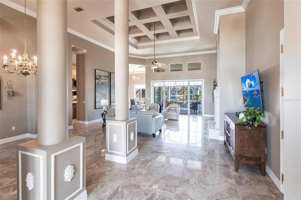 Expansive open-concept layout seamlessly connecting the foyer, living room and formal dining area.