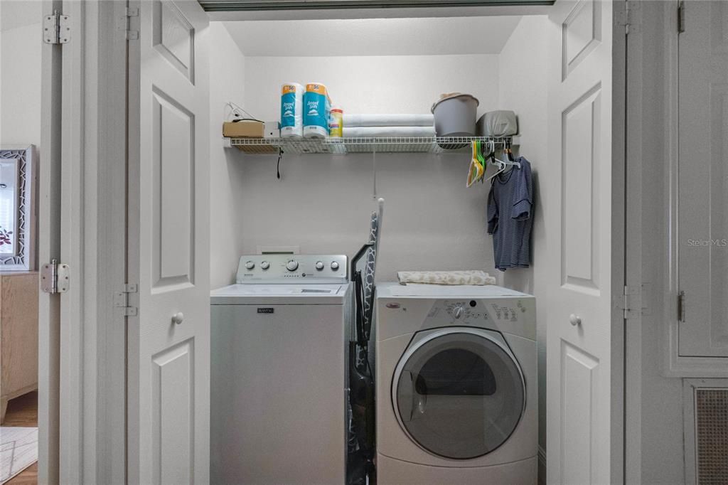 The laundry room is conveniently located near the bedrooms ...... yes the washer and dryer both stay