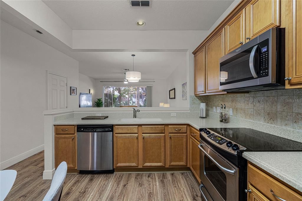 Lovely wood cabinetry and ample counter space