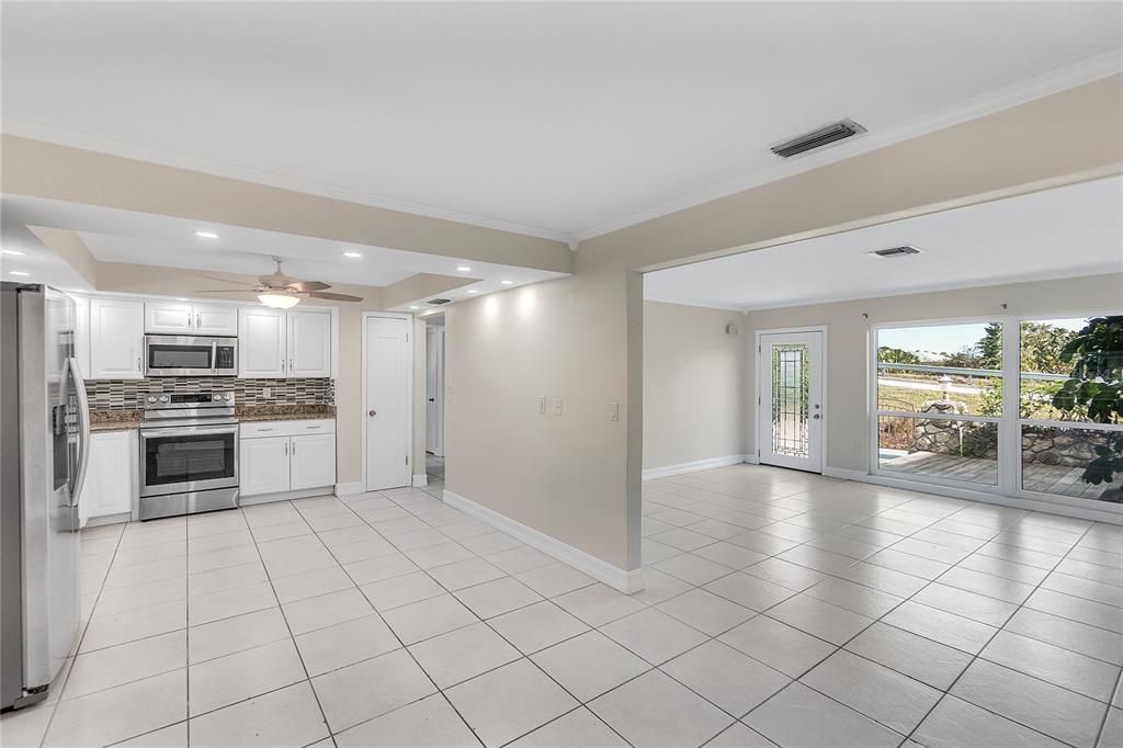 OPEN SPACE - KITCHEN FLOWS INTO FORMAL DINING AREA AND MAIN LIVING AREA