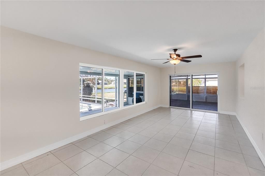 FAMILY ROOM WITH SLIDER DOOR LEADING TO FLORIDA ROOM