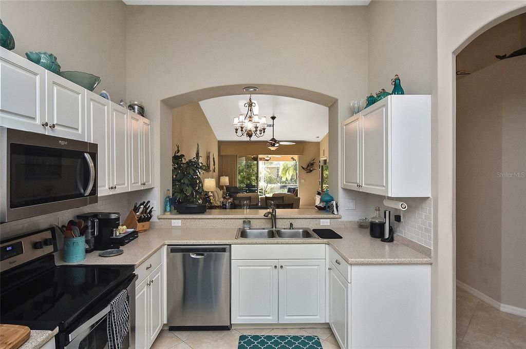 Large Kitchen with arched pass through to Dining Area