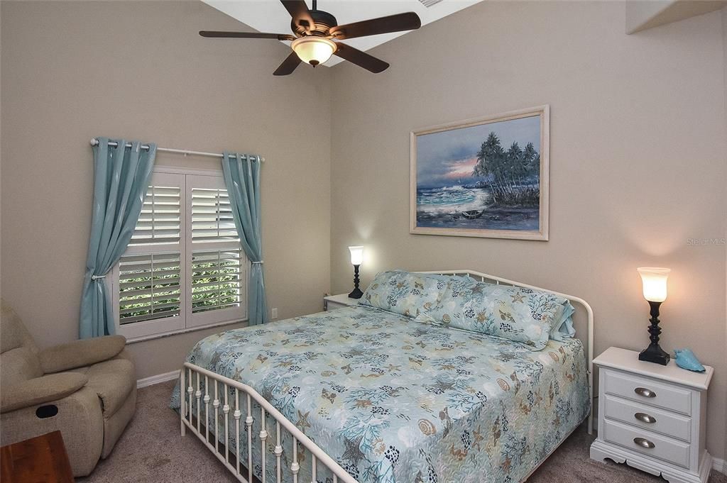 Guest Bedroom with cathedral ceilings and ceiling fan