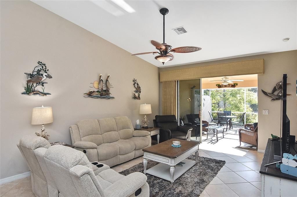 Living room with sliding patio doors to covered lanai