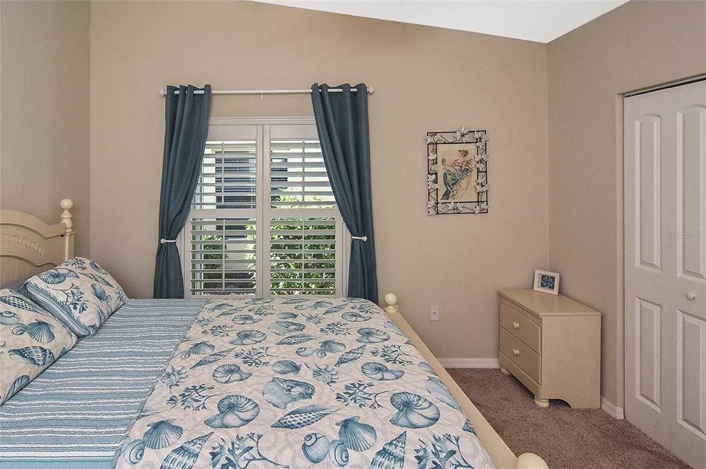 Guest Bedroom with high ceilings