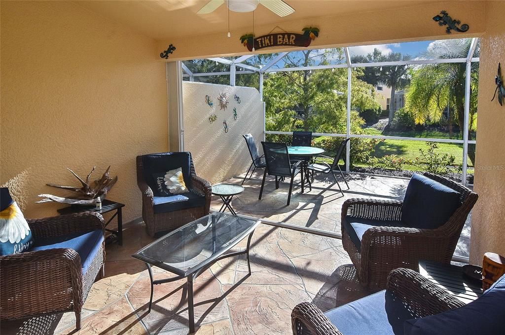 Covered Lanai and screened patio with privacy landscaping