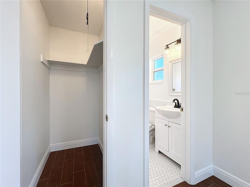 walk in closet in primary bedroom