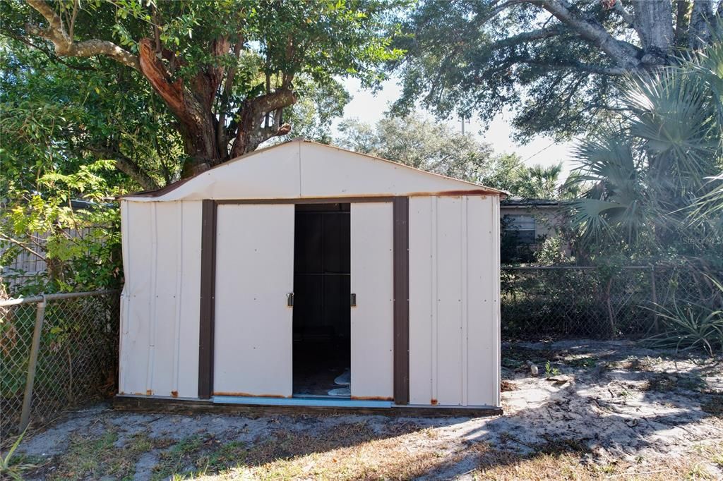 Backyard shed is included with this home.