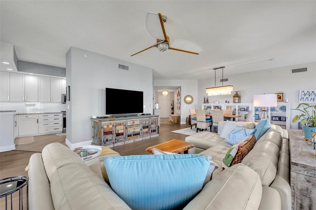 Living room open to dining area and kitchen.