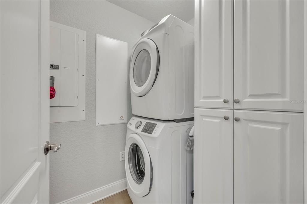 Laundry room with storage.