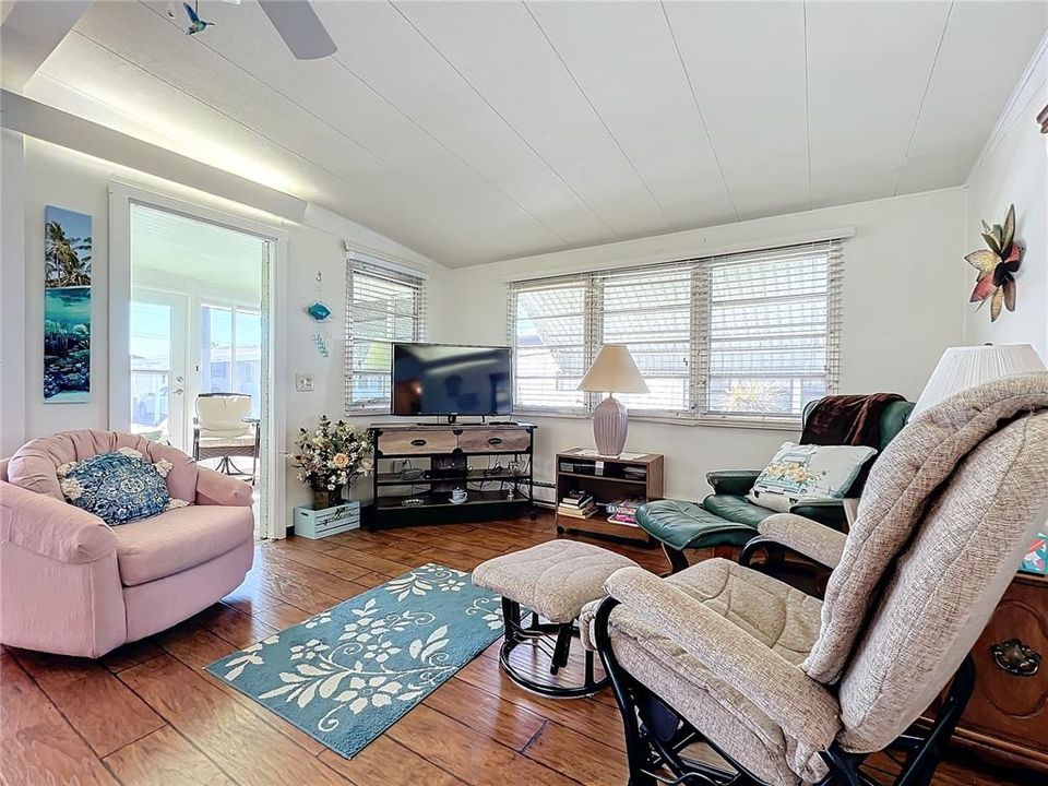 Living room with door leading to the sunroom.