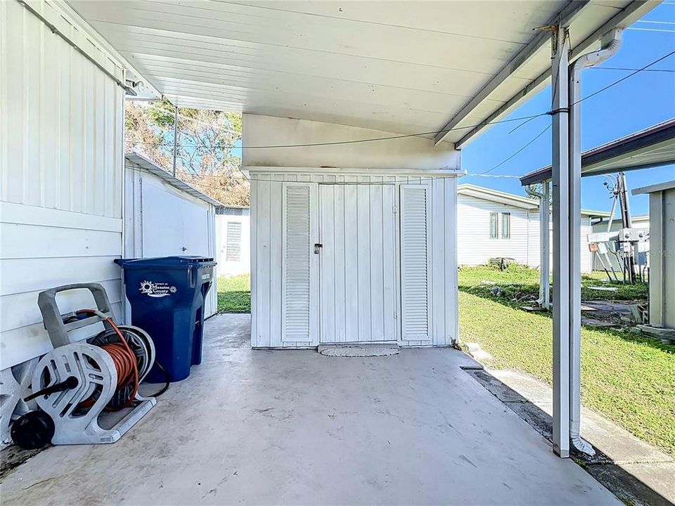 One shed to the left and another in the carport.