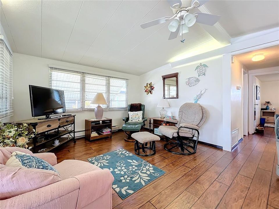 Living room with wood laminate flooring.