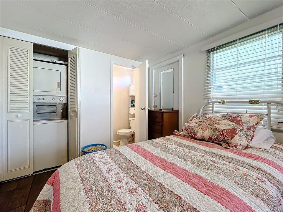 Convenience of a stackable washer and dryer, and half bathroom in the primary bedroom.