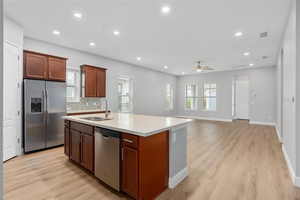 Open floor plan with kitchen, dining and living room