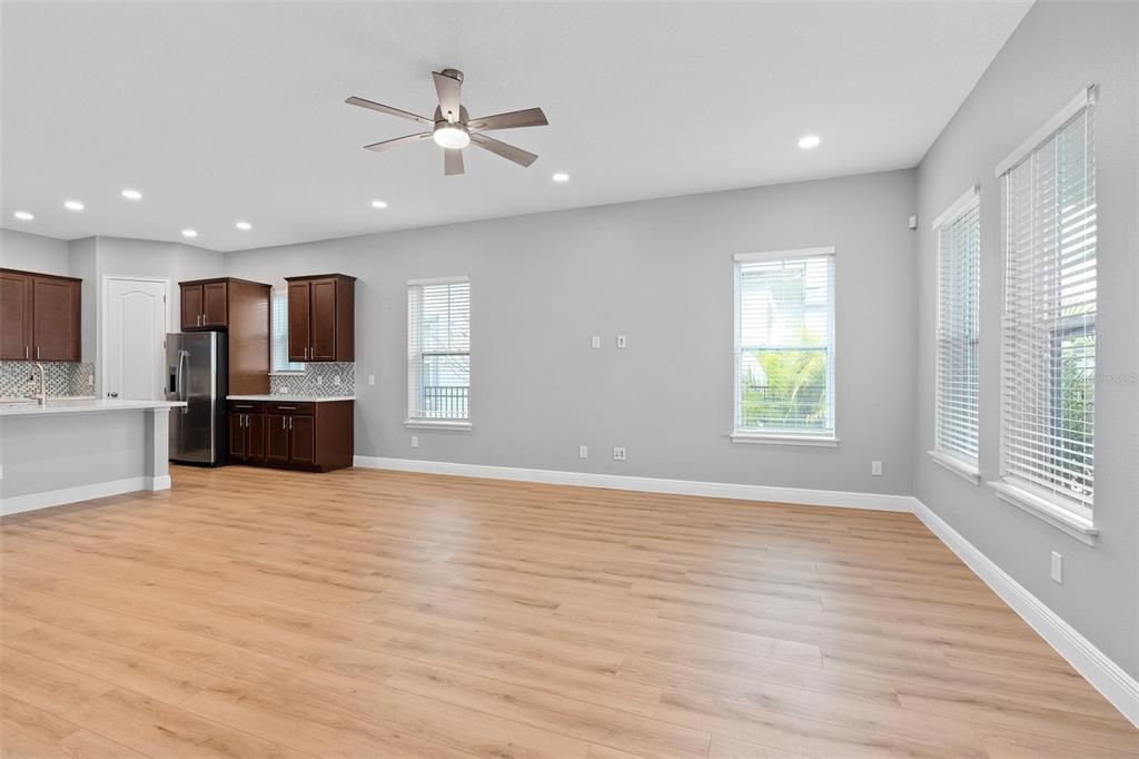 Open floor plan living room with brand new vinyl luxury plank flooring