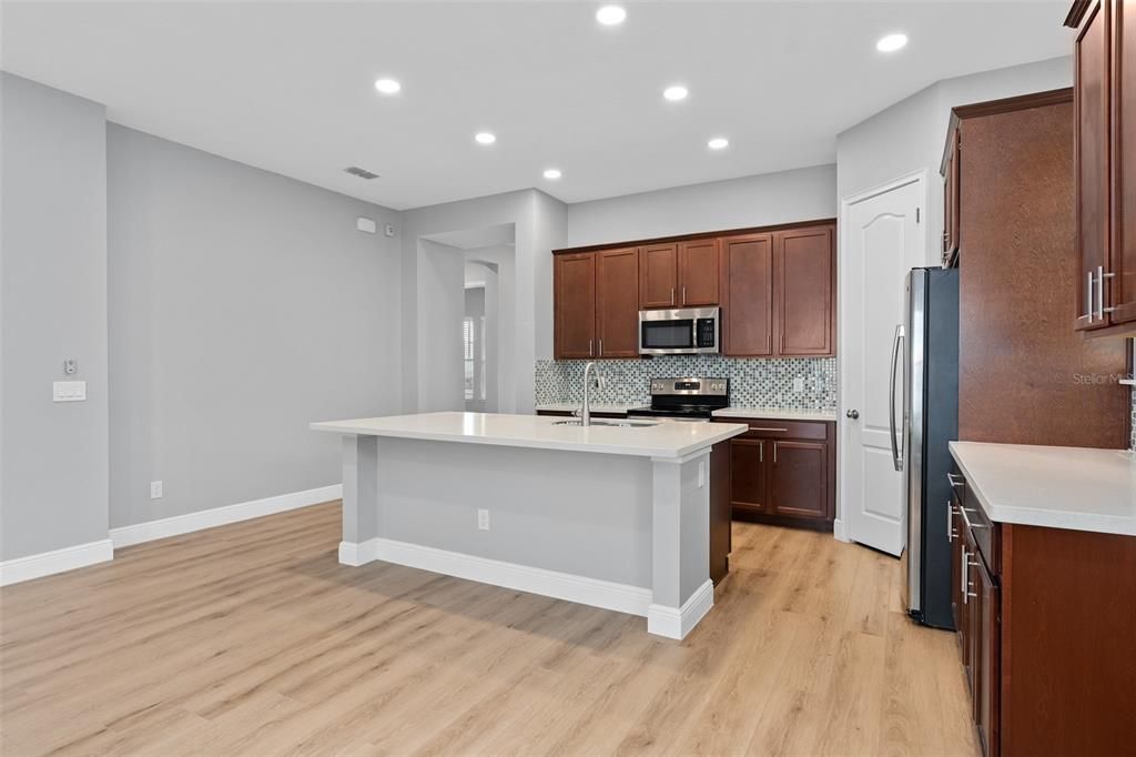 Open floor plan with kitchen, dining and living room