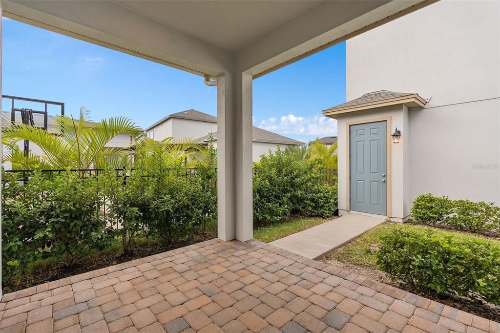 Covered Back porch leading to detached garage