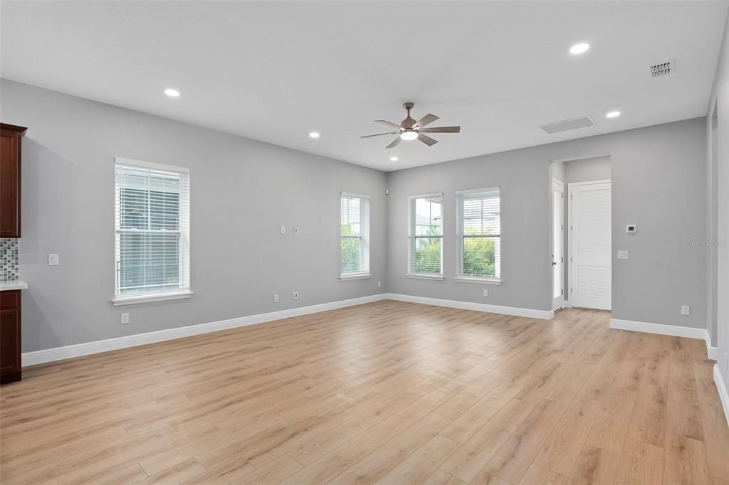 Open floor plan living room with brand new vinyl luxury plank flooring