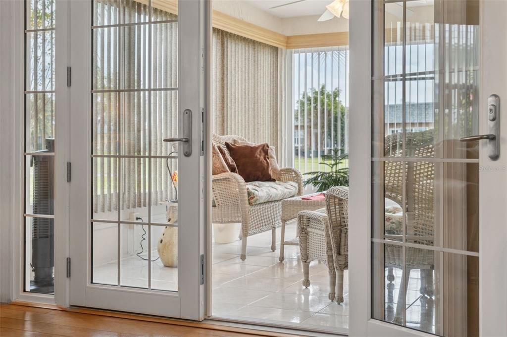 Hurricane Impact Rated French Doors with Sidelites lead out to sunny Florida Room