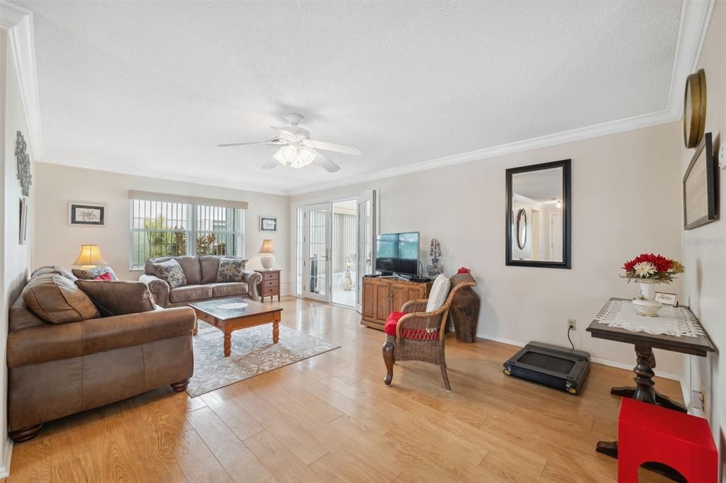 Spacious Living Room area leads to nicely enclosed Florida Room