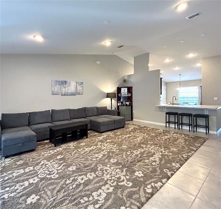 Stylish Open-Concept Living Room with Soaring Ceilings