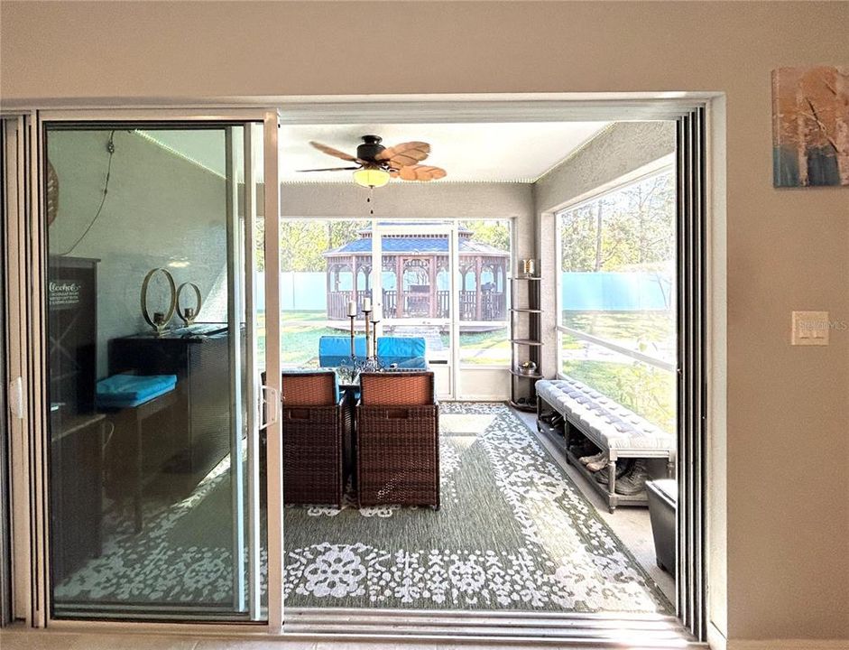 Expanding Sliding Glass Doors Lead to Screened-in Lanai