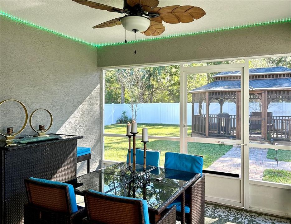 Screened-in Lanai with Ceiling Fan and Patio Furniture