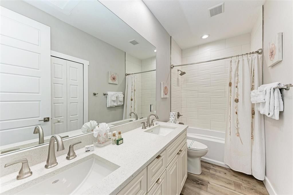 2nd floor 3rd bathroom with dual sinks and tub