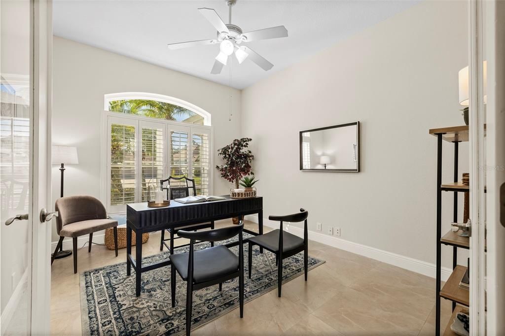 Office with French doors and shutters.