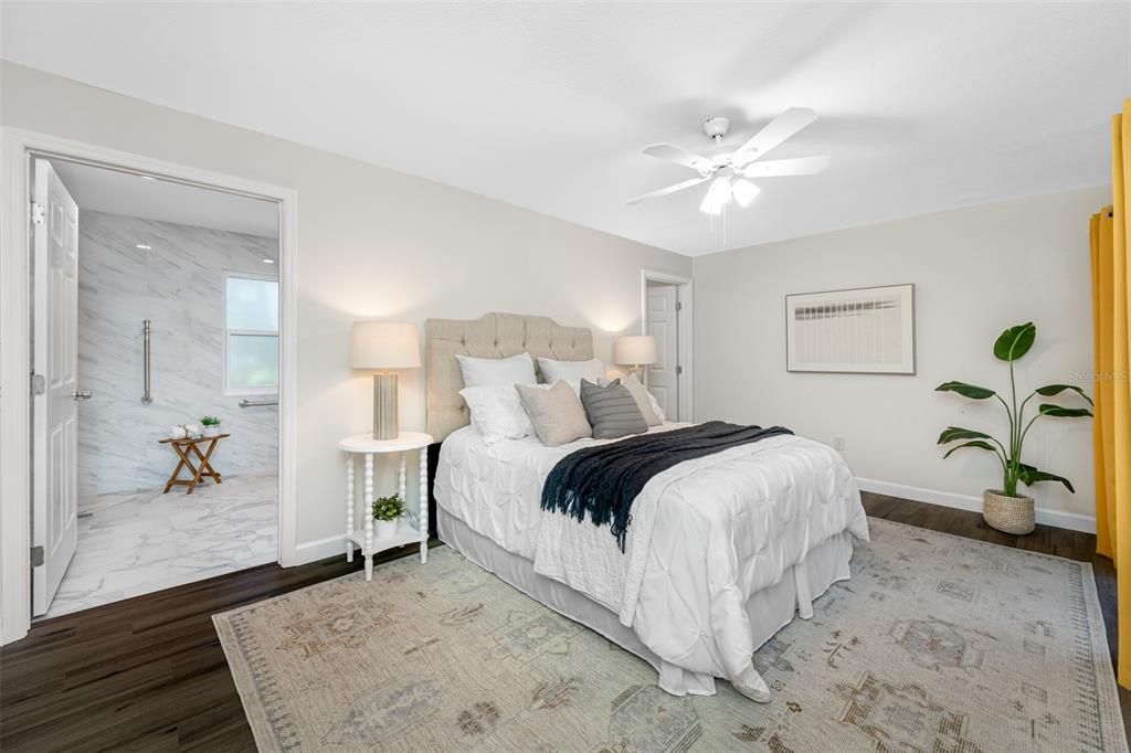 Primary bedroom with ensuite bath and walk-in closet