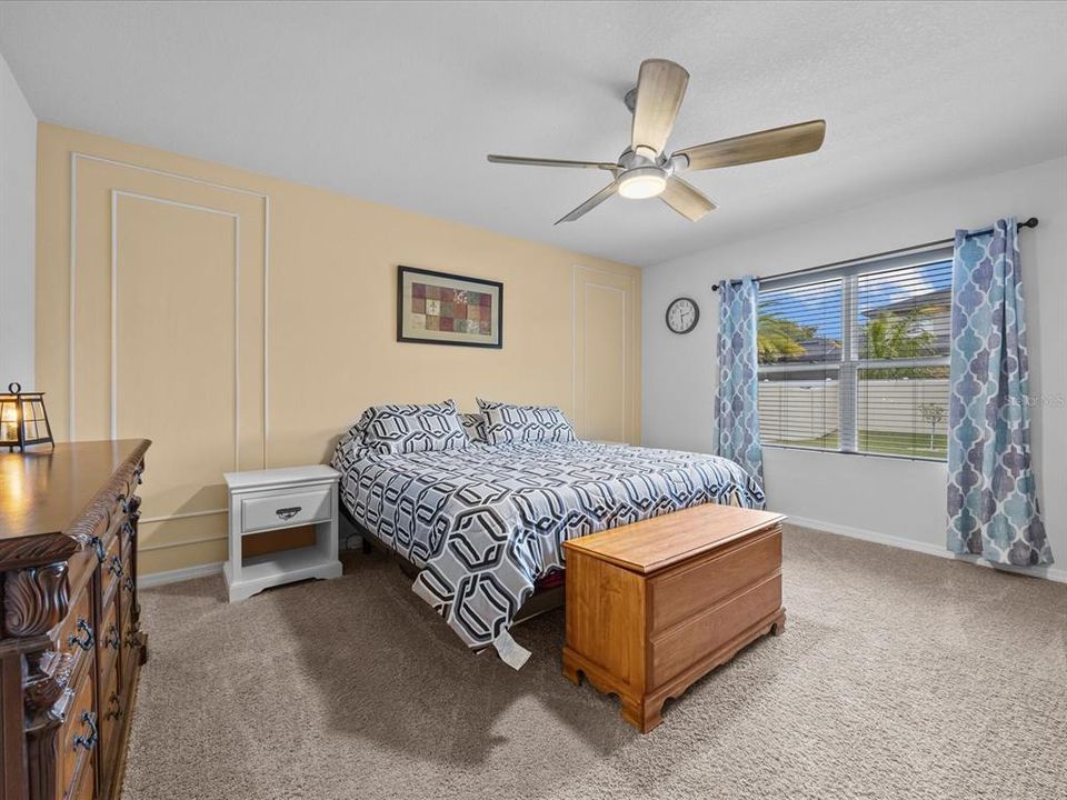 Primary bedroom with view into the back yard