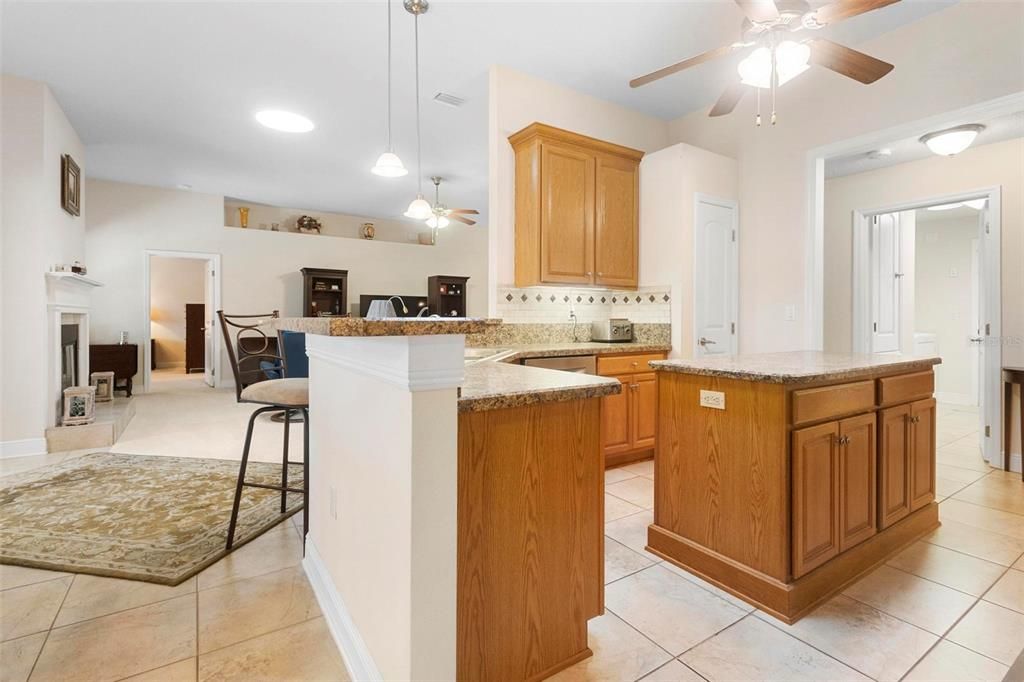 Kitchen at right. Dining area and living area at left.