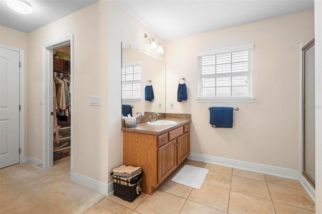 Ensuite bath. Walk-in closet at left.