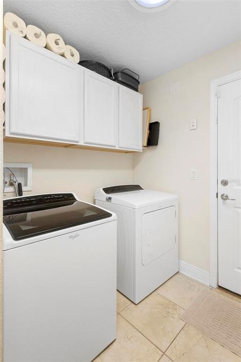 Washer and dryer in the laundry room convey.