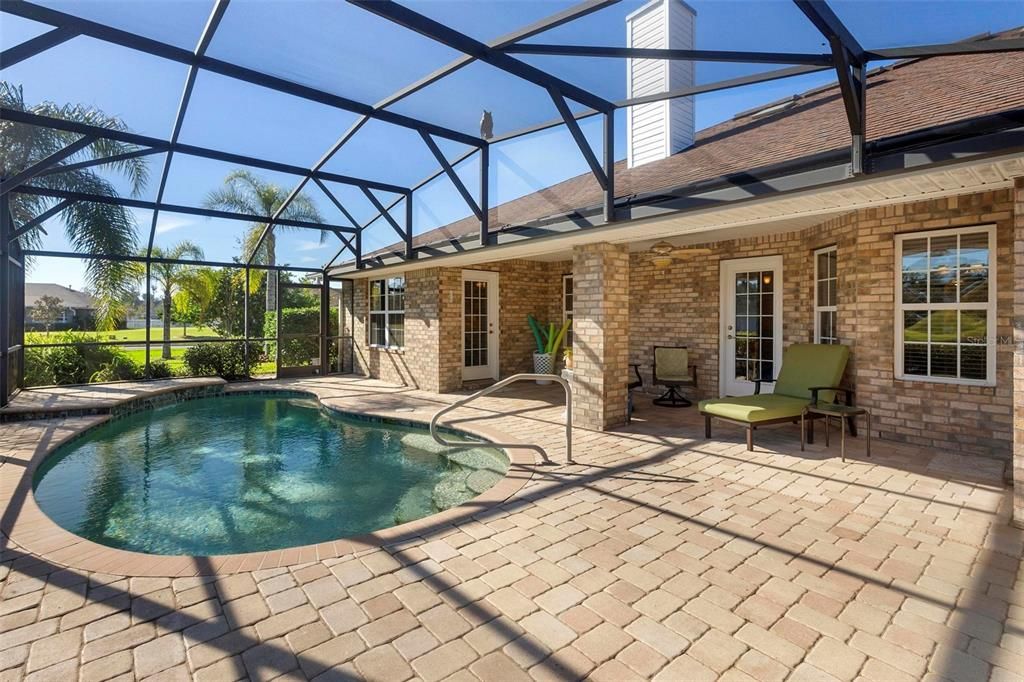 Rear view of home and covered lanai. The pavers are beautiful!