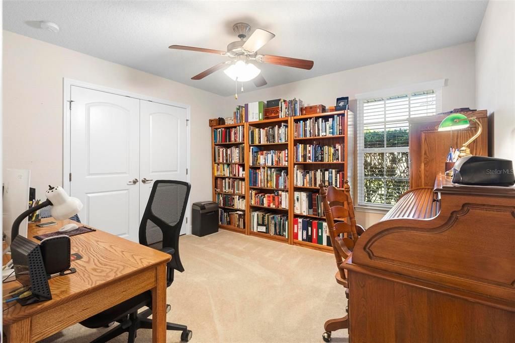 Bedroom #2 is being used as an office and library.