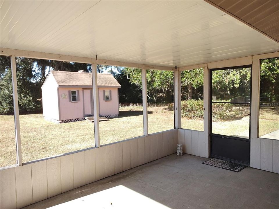 Screened back porch with workshop